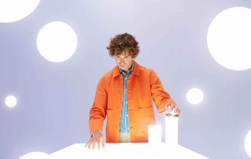 Futuristic scene of a man looking into a table of light