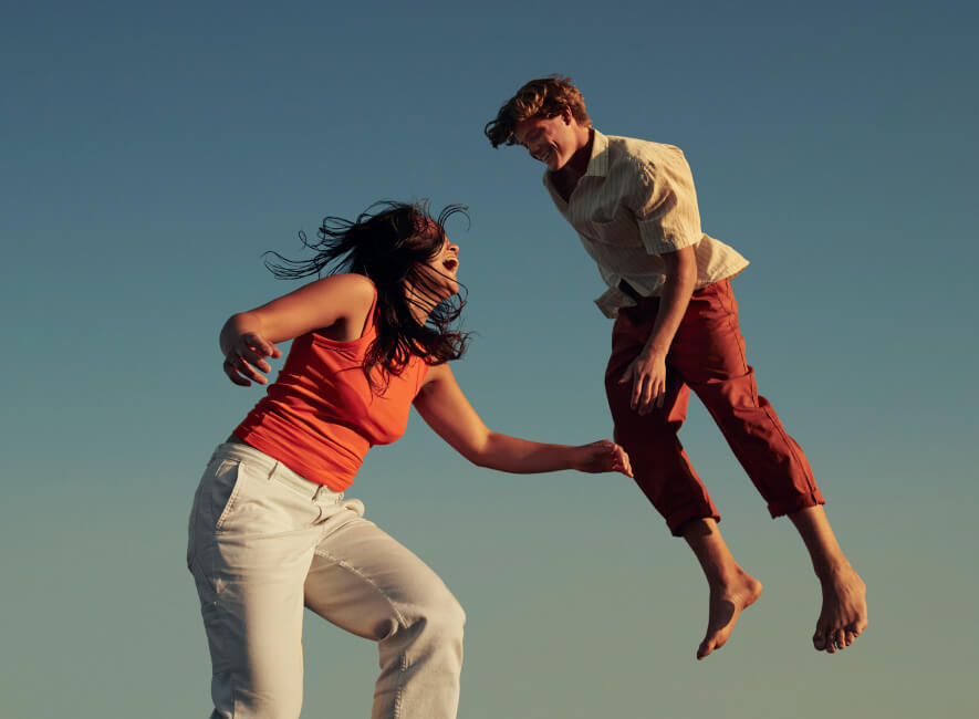 Woman and man jumping in heaven